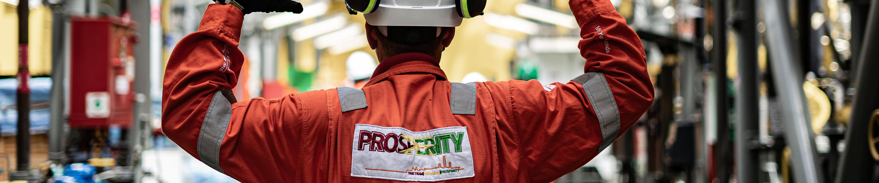 back of a local worker in protective gear