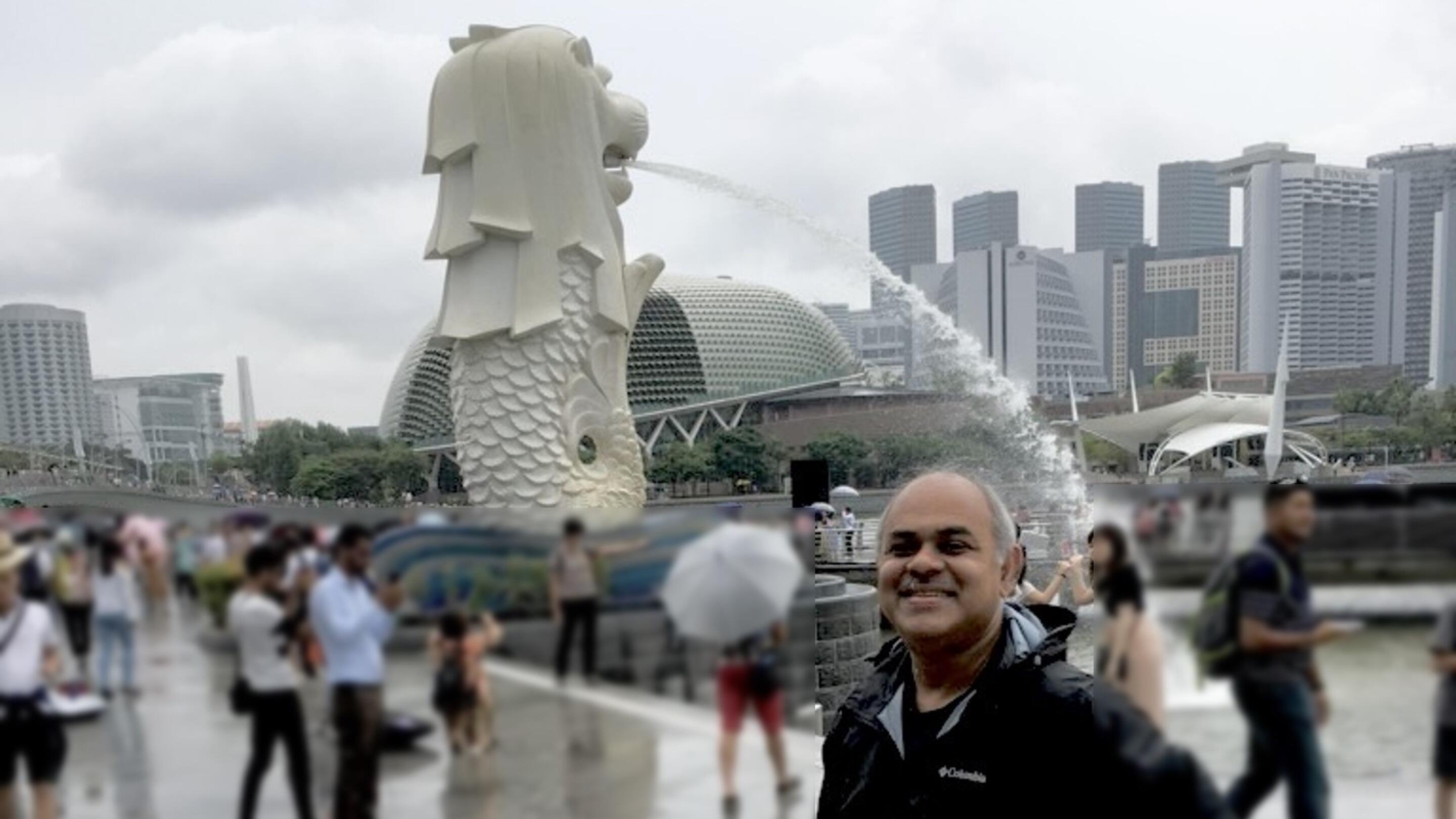 Tahmid Mizan in Singapore with the Merlion