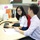 employees at Bangkok office having a discussion while sitting at desk