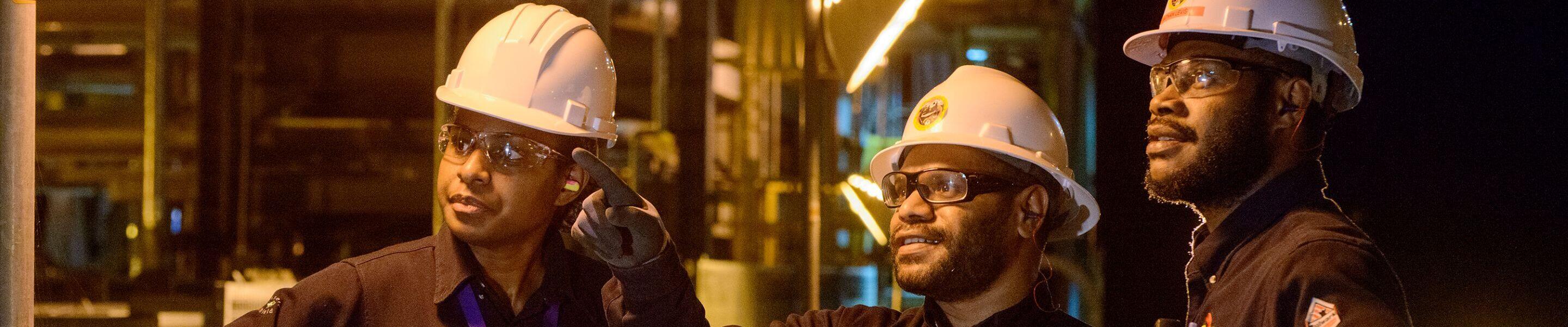 ExxonMobil employees working at night