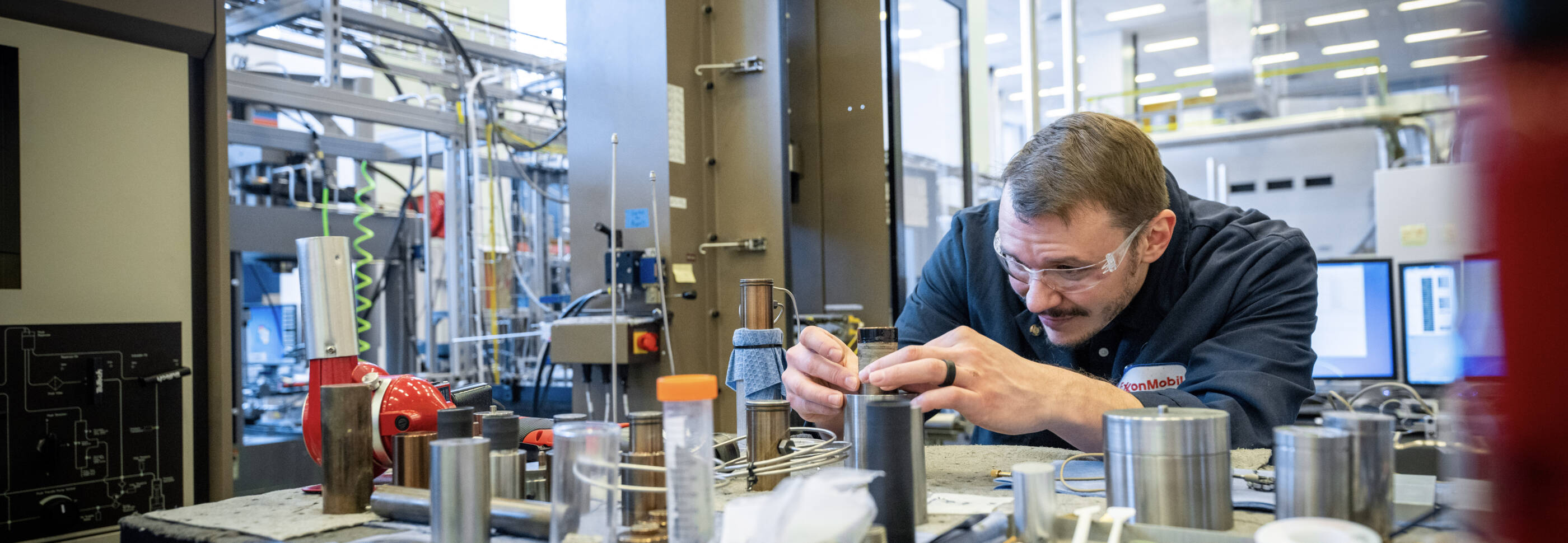 ExxonMobil employee working in a mechanical lab.