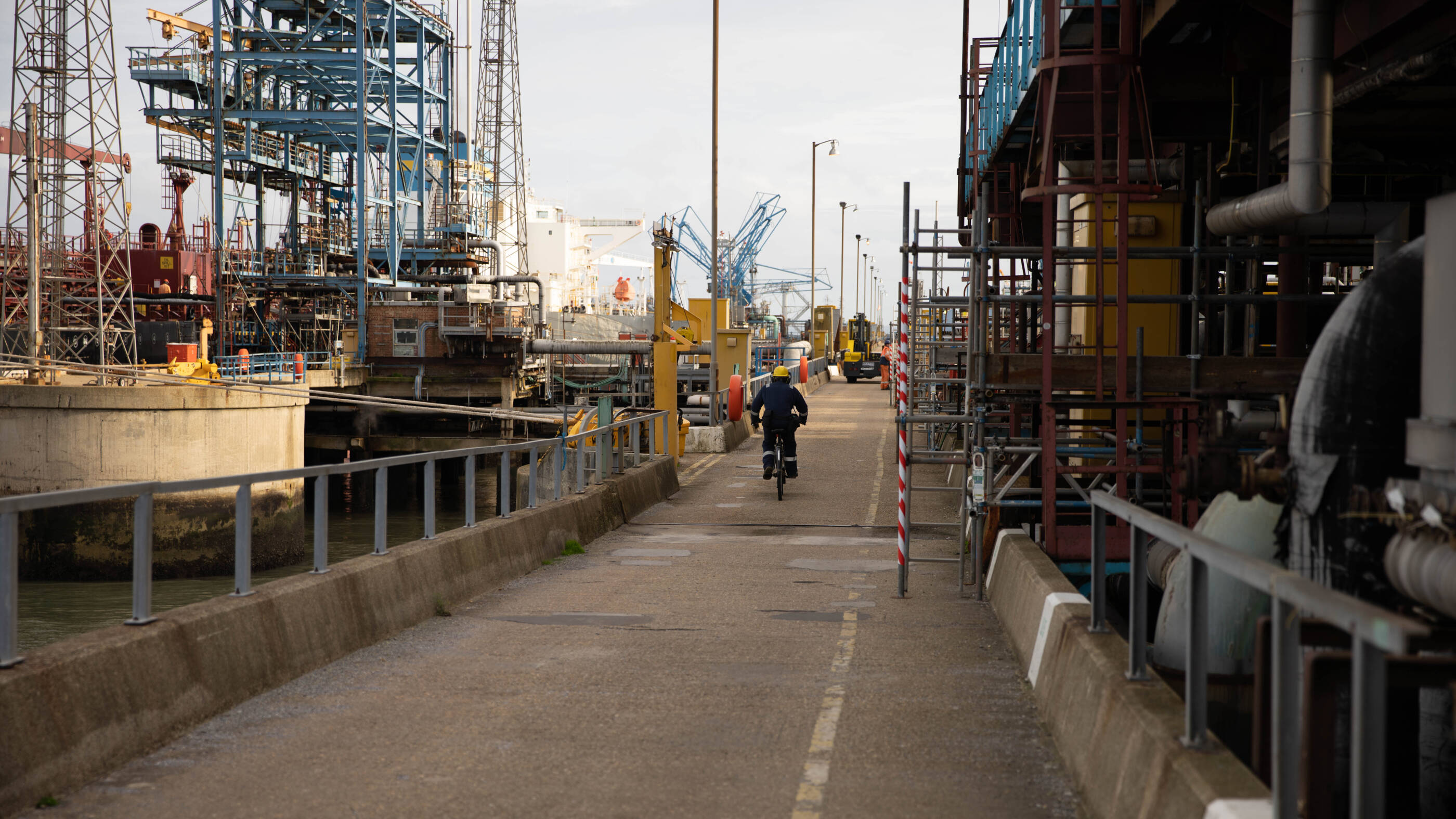 employee bicycling through complex
