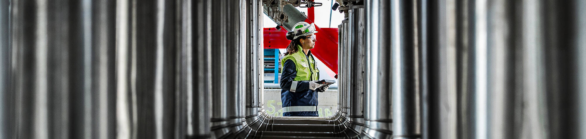 Rotterdam refinery worker amongst pipelines