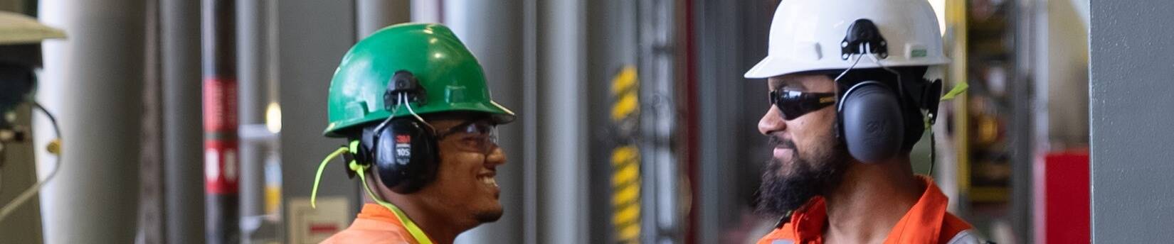 Two ExxonMobil Guyana employees working on the Liza Destiny