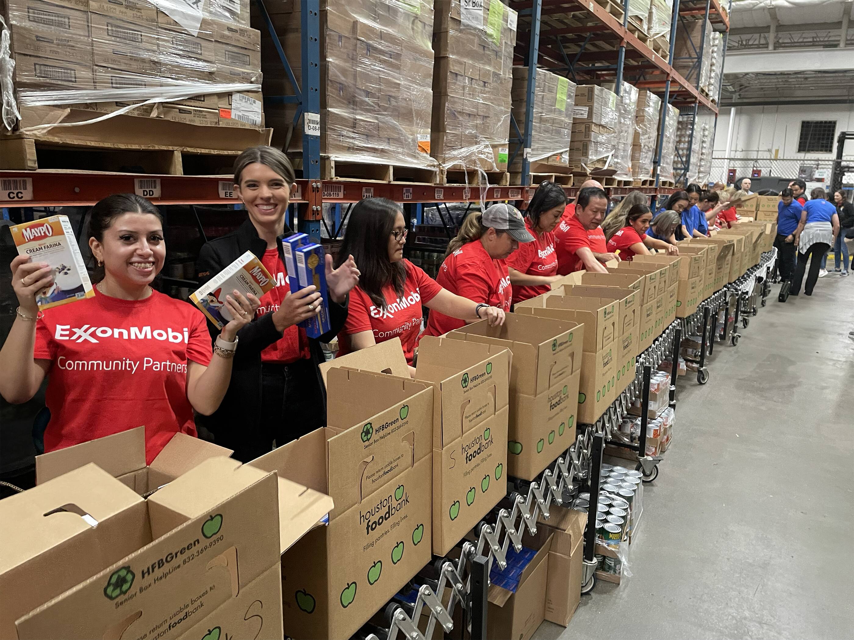 ExxonMobil volunteers in a foodbank