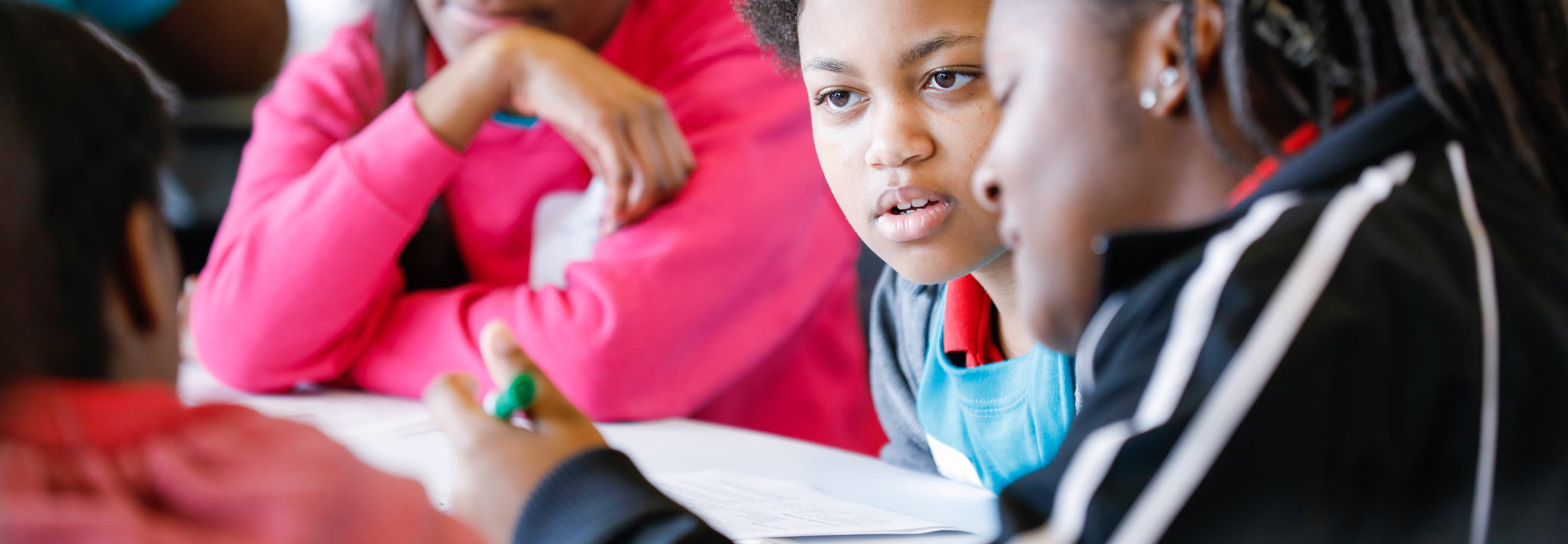 A group of students around a table