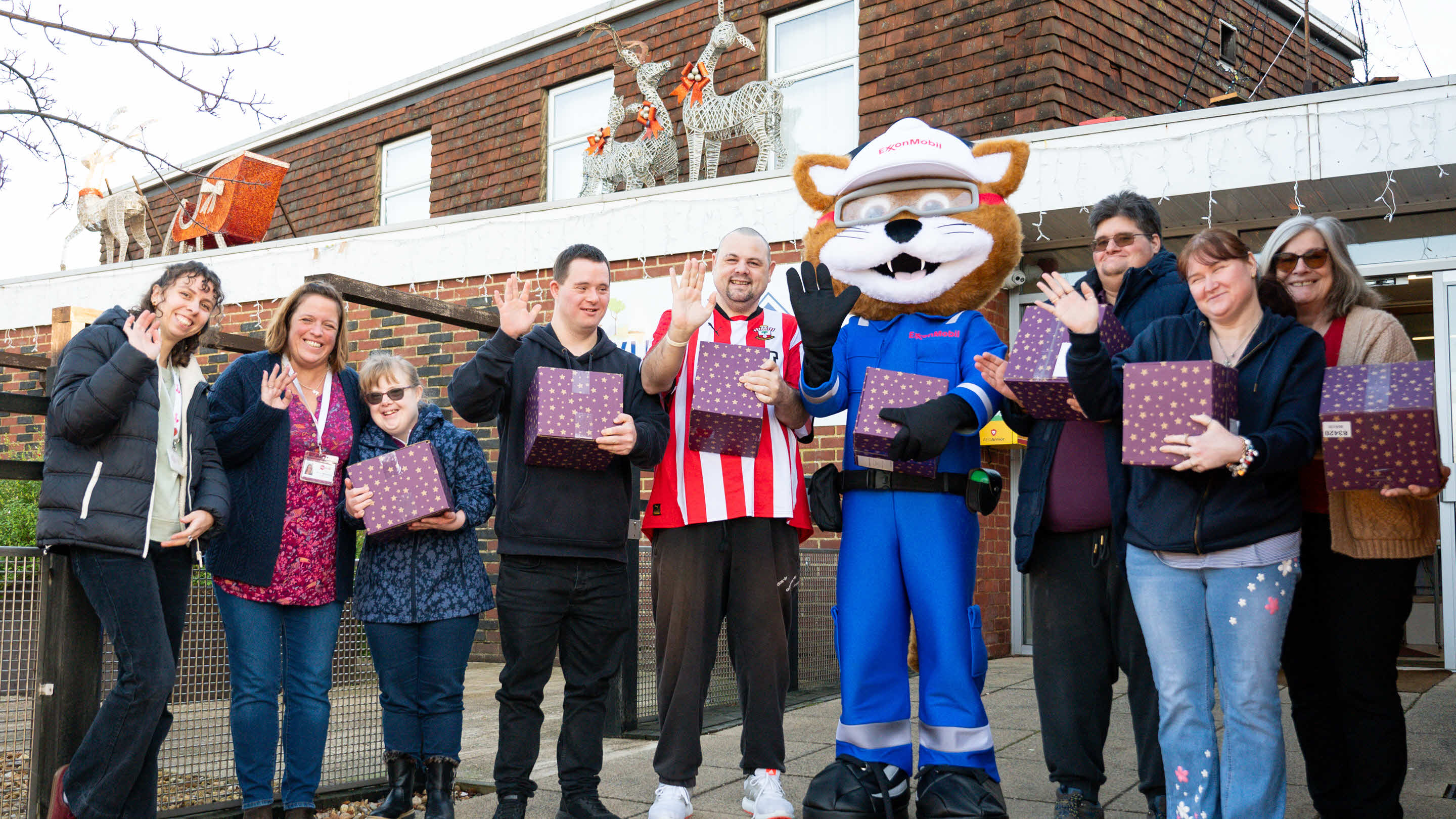 some Christmas hamper recipients and ExxonMobil Fawley's mascot