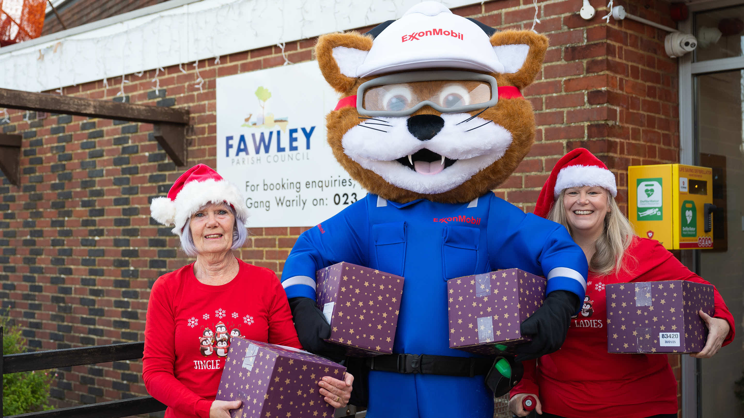 Christmas hamper volunteers and ExxonMobil Fawley's mascot